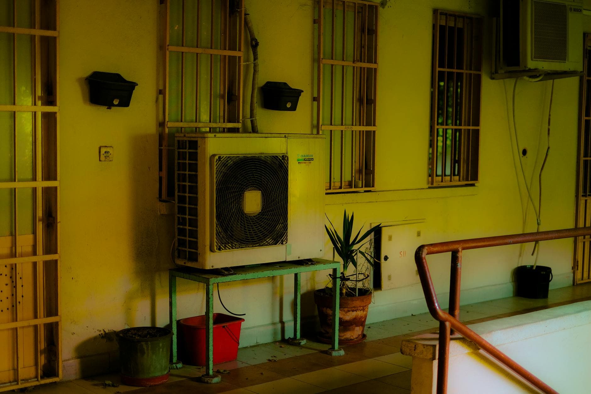 Residential AC outdoor unit beside a house