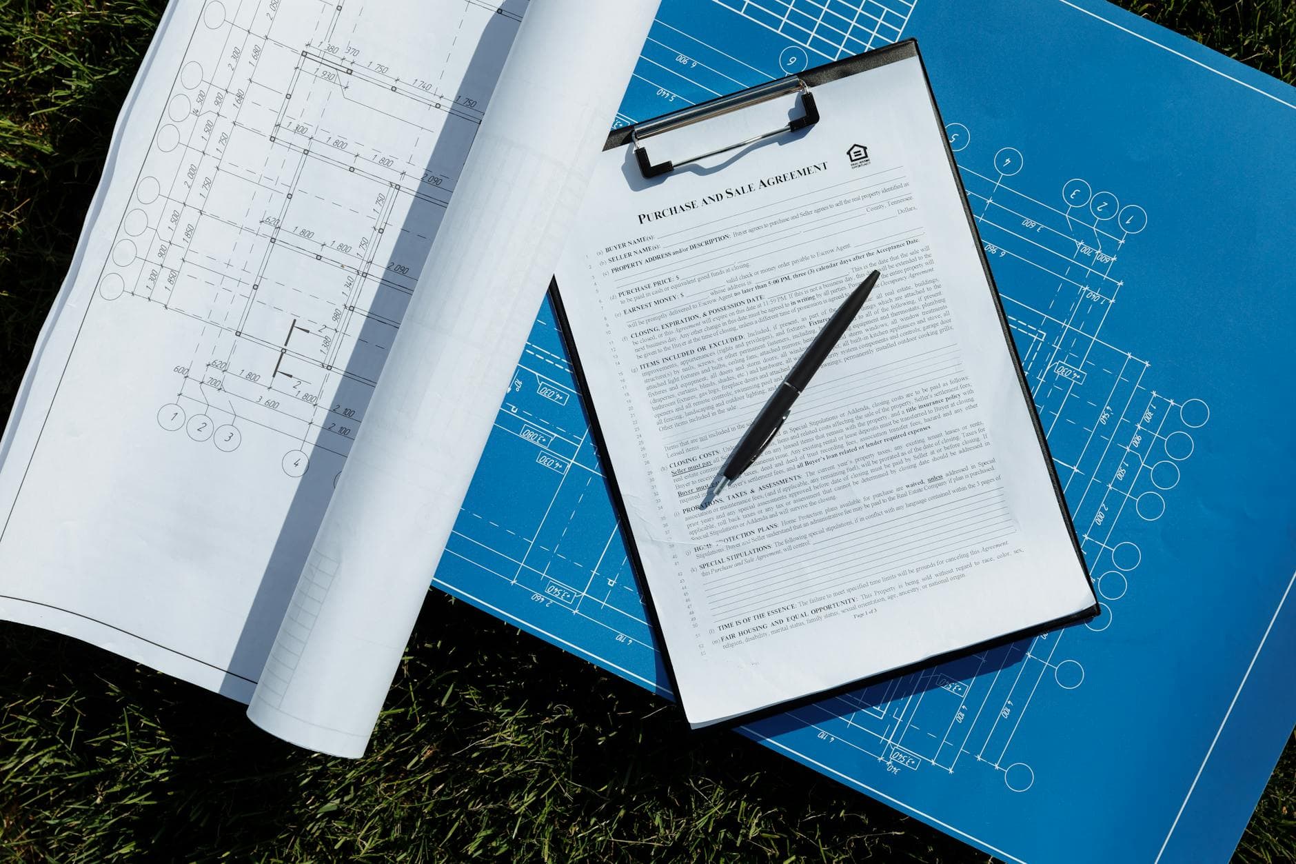 Landscape estimate paperwork on a clipboard outdoors